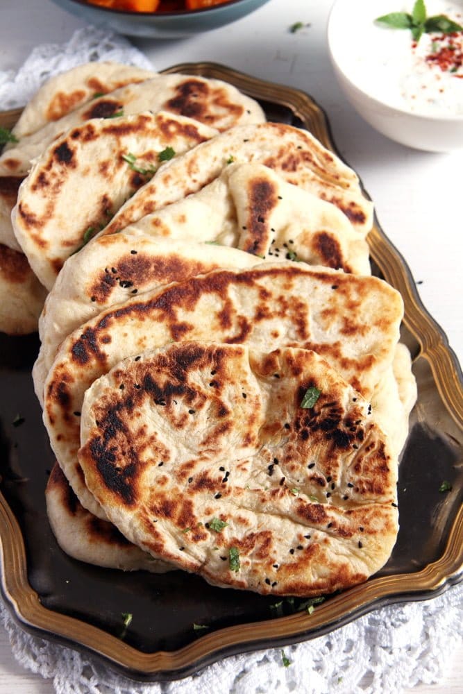 thick and fluffy afghan bread on a silver platter