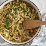 skillet with sauteed savoy cabbage and bacon