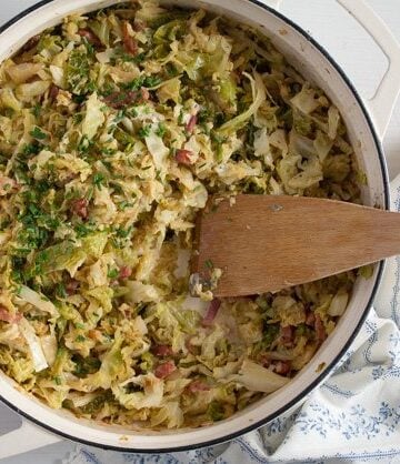 skillet with sauteed savoy cabbage and bacon