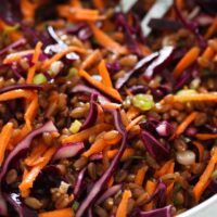 cooked spelt, red cabbage and carrots in a bowl