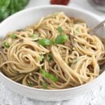 white bowl full of pasta with aubergine sauce