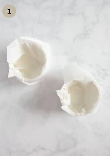 two small ramekin dishes lined with parchment paper.