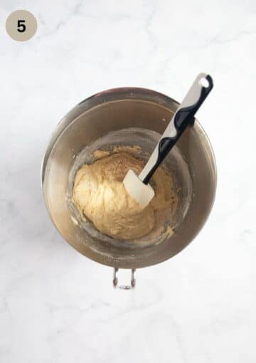 folding flour into cake batter with a spatula.