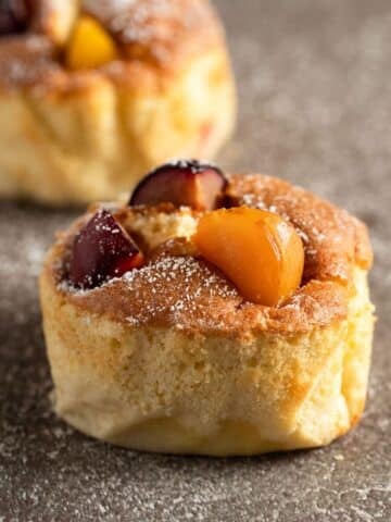 two mini plum clafoutis made after an ottolenghi recipe.