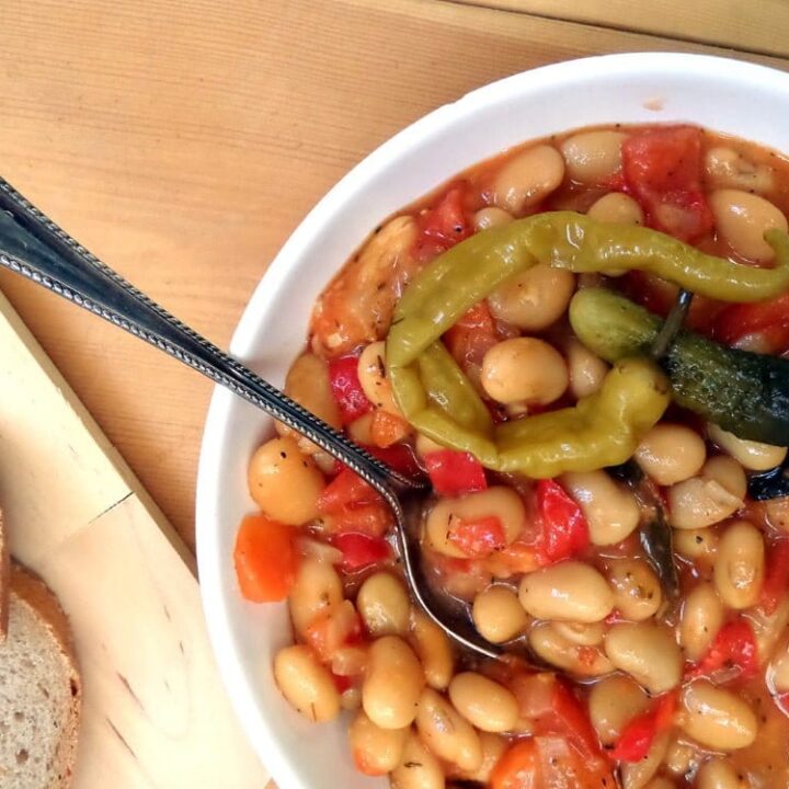 white bean stew in a white bowl