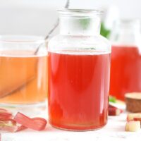rhubarb simple syrup in a small bottle
