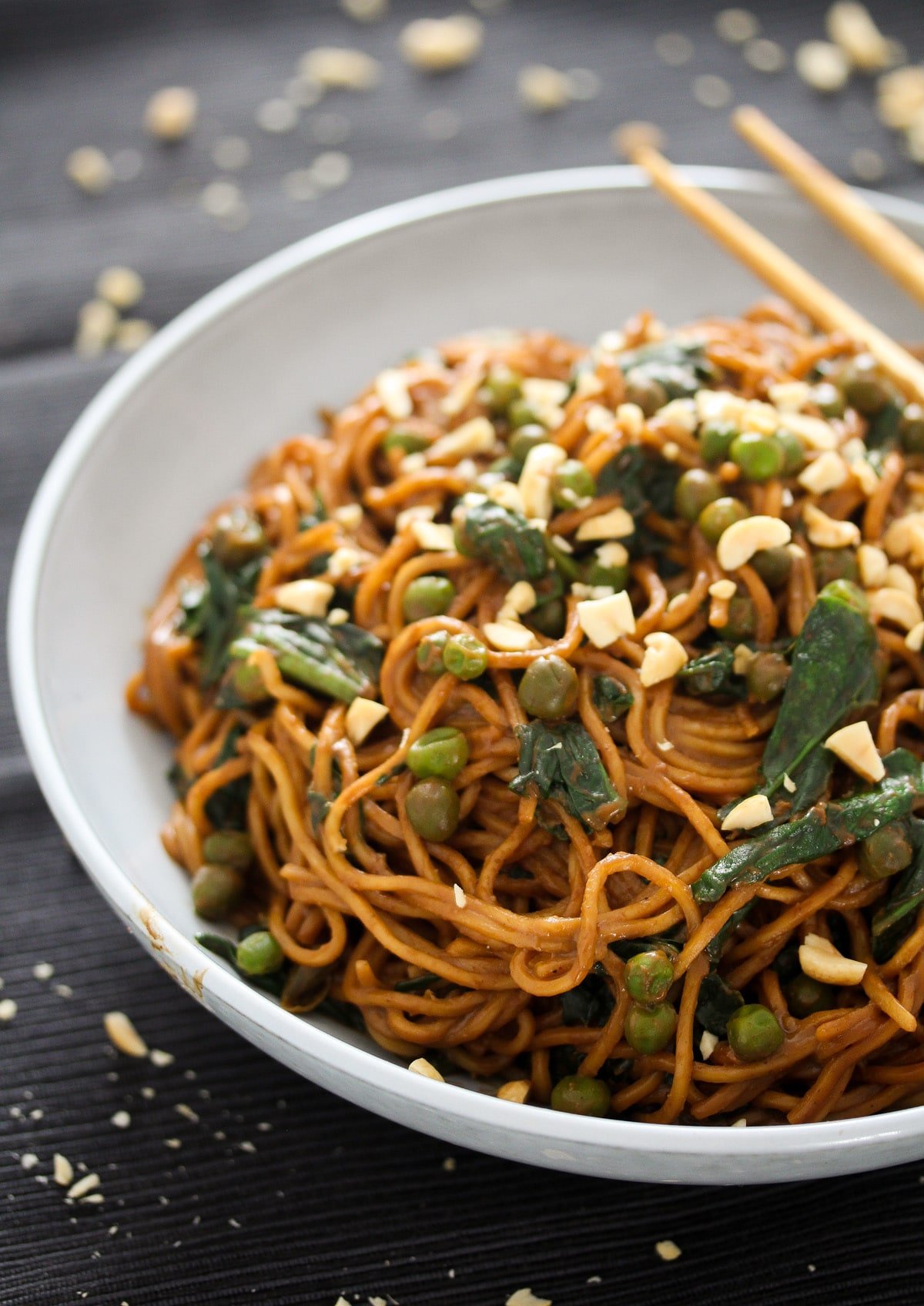 bowl of peanut noodles with soy sauce and vegetables