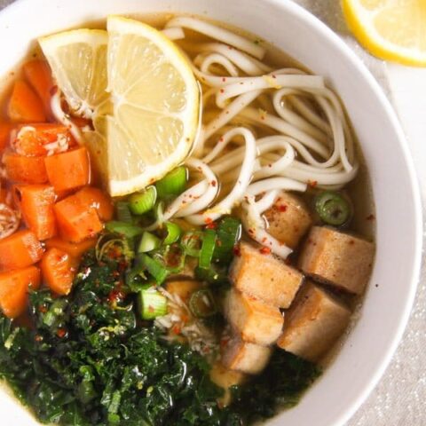 bowl with noodles, tofu and vegetables in broth