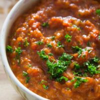 eggplant red pepper dip in a traditional bowl