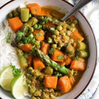 asparagus curry with coconut milk in a white bowl