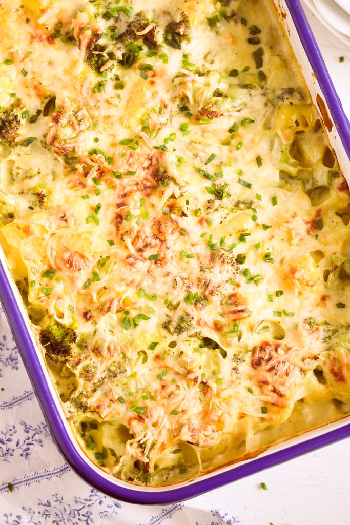 casserole dish with potatoes and broccoli seen from above.