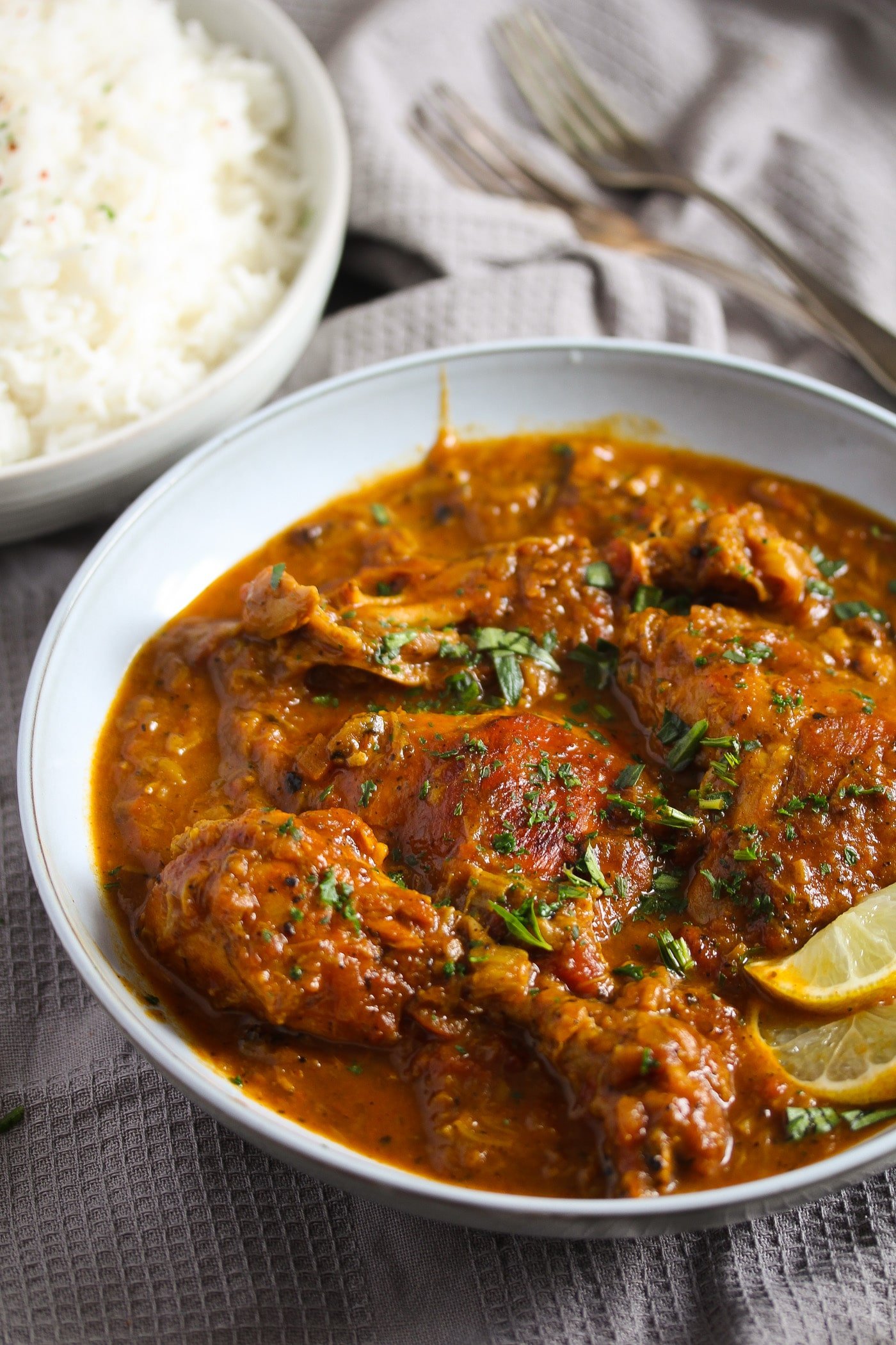 rhubarb chicken with lots of red sauce with turmeric