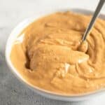 peanut butter with homemade roasted peanuts in a bowl.