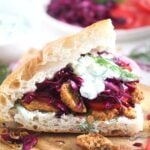 german gyros or doner kebab with tzatziki on a wooden board.