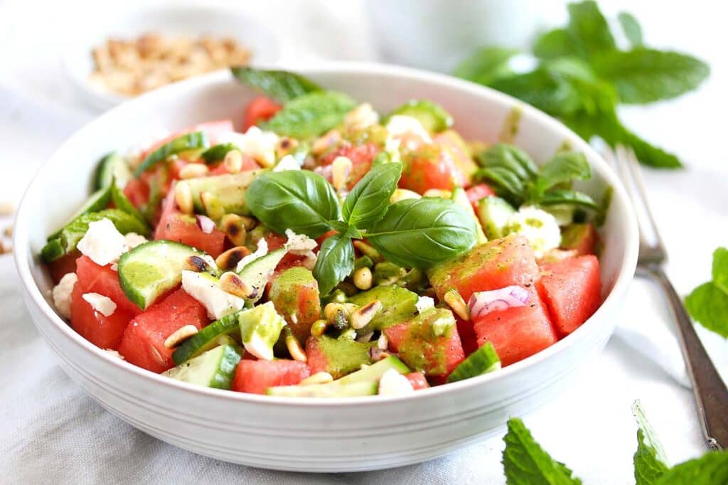 watermelon balsamic salad with feta and basil in a bowl