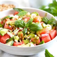 watermelon balsamic salad with feta and basil in a bowl