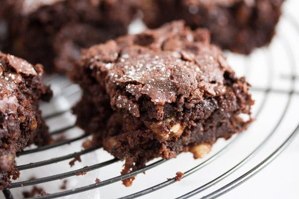 zucchini chocolate brownies square on a rack.