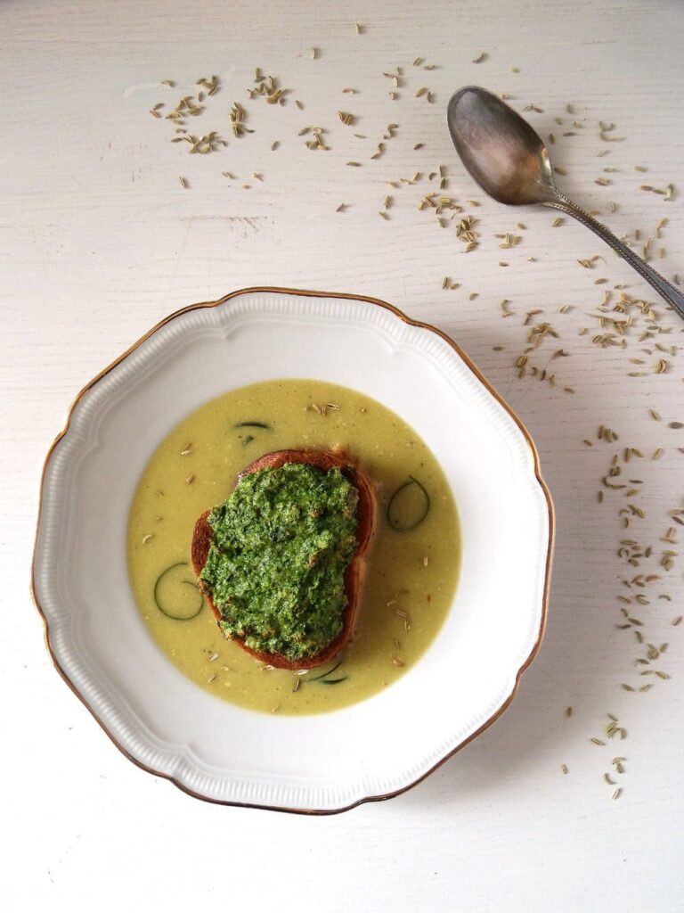soup with zucchini and fennel seeds in a soup plate