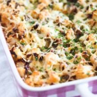 beef bake with cauliflower and cheese in a pink baking dish
