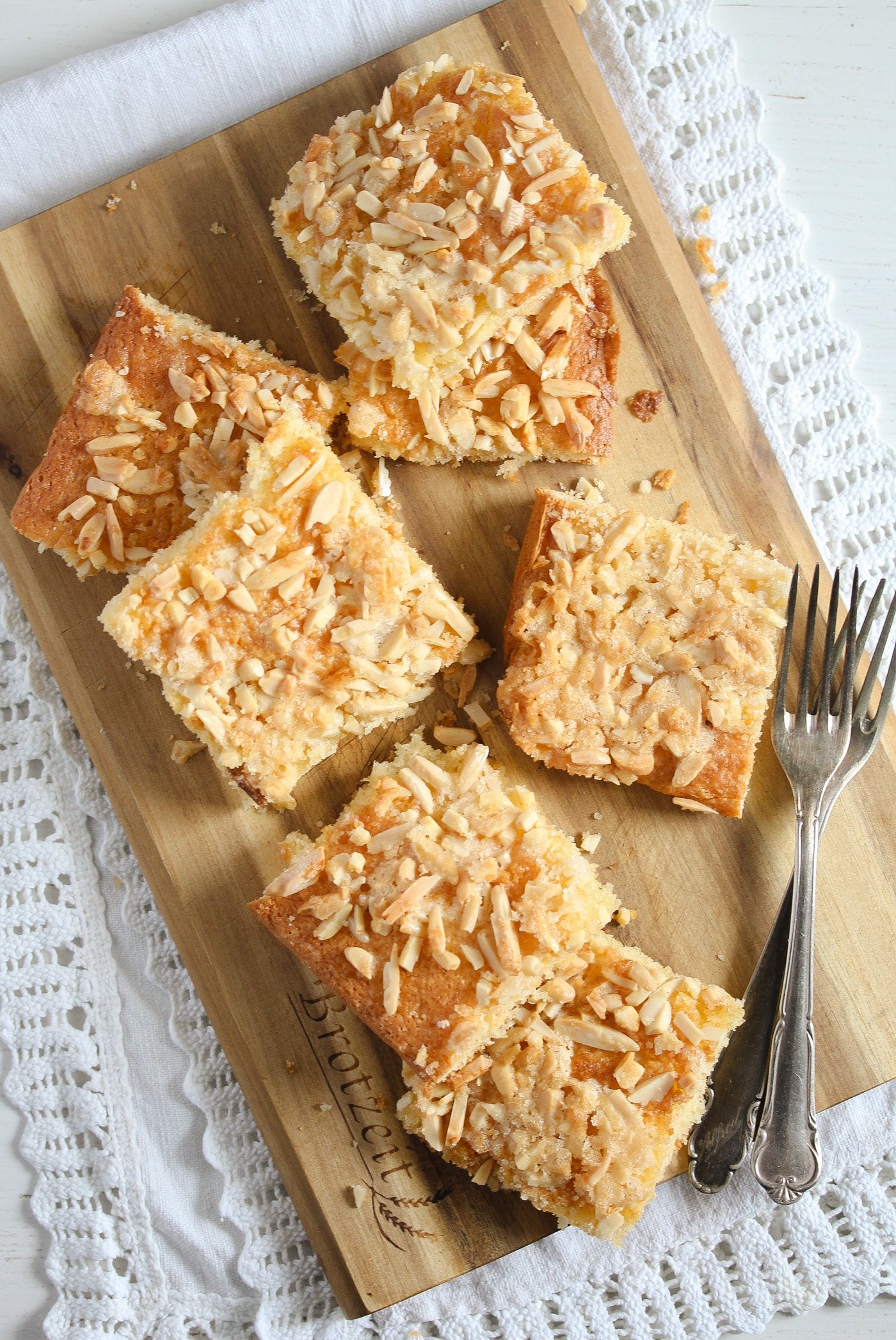 german coffee cake with sugar almond topping on a wooden board