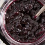 homemade blueberry sauce in a jar close up.