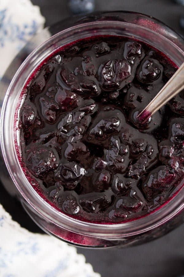 shiny homemade blueberry sauce in a jar