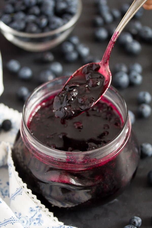 jar of blueberry sauce and blueberries