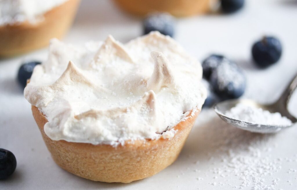 one blueberry tartlet with meringue topping close up