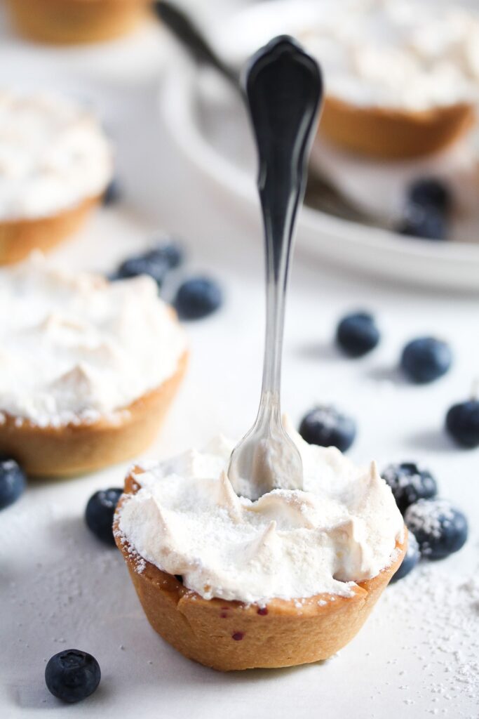 one mini tart with a dessert fork stuck into it