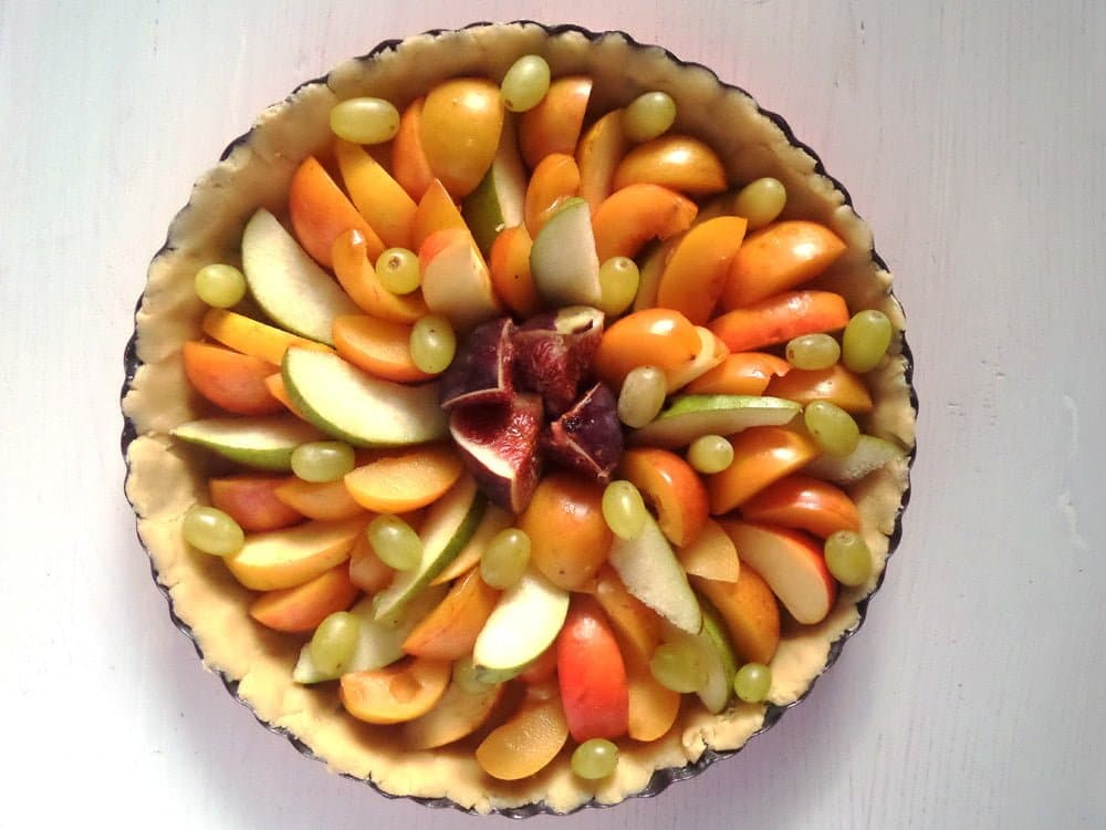 unbaked fall fruit in a pie dish