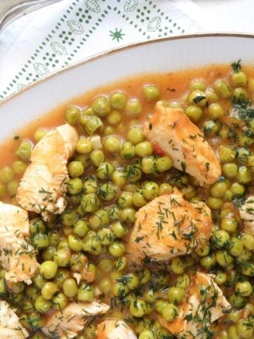 Romanian chicken and peas stew close up ready to be served