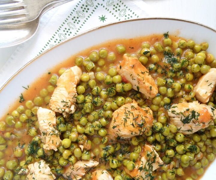 Romanian chicken and peas stew close up ready to be served