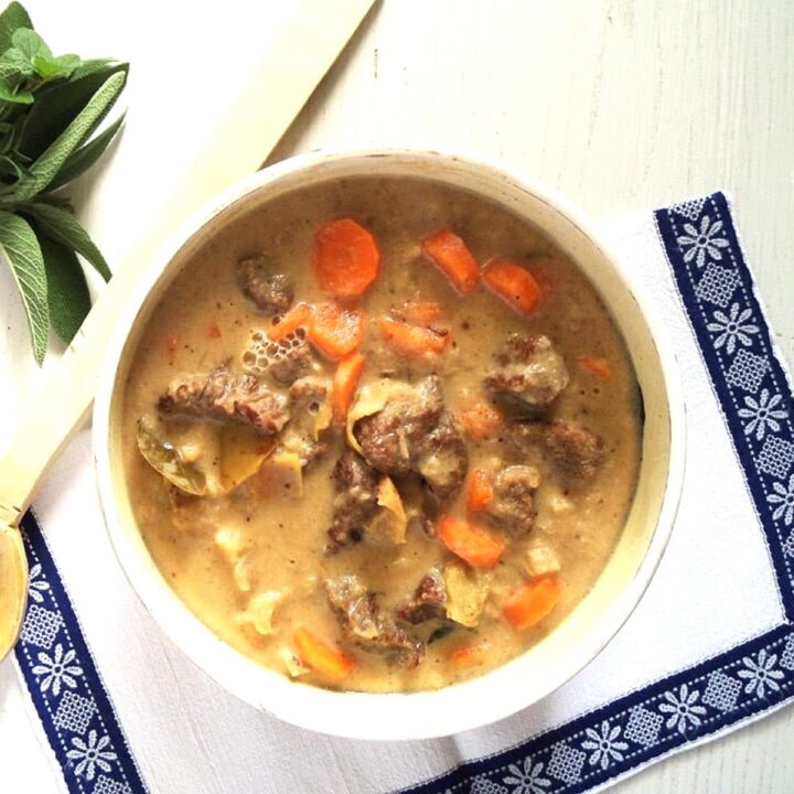 dutch oven beef apple stew in a serving bowl