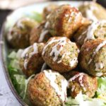 broccoli balls with parmesan sprinkled with mayonnaise.