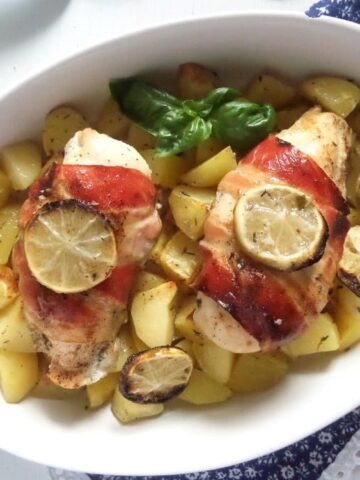 bacon wrapped chicken with herbs and potatoes