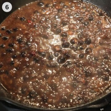 thickened blueberry sauce for turkey in a skillet on the hob.