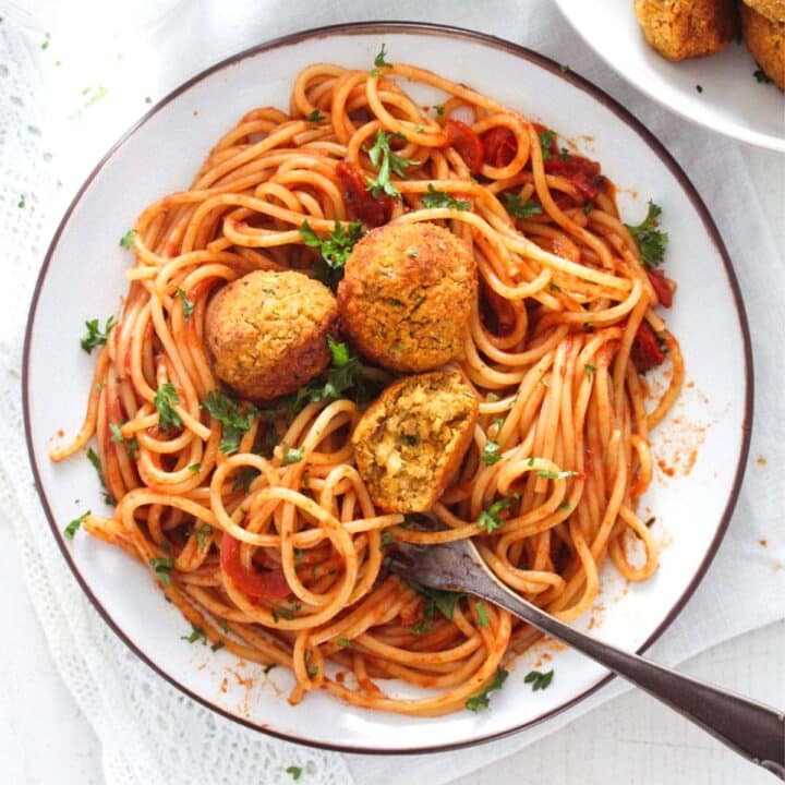 chickpea meatballs served with spaghetti and tomato sauce.