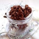 choco crossies in a jar with a ribbon around it.