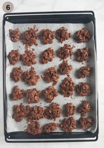 freshly shaped chocolate crossies drying out on a lined baking sheet.