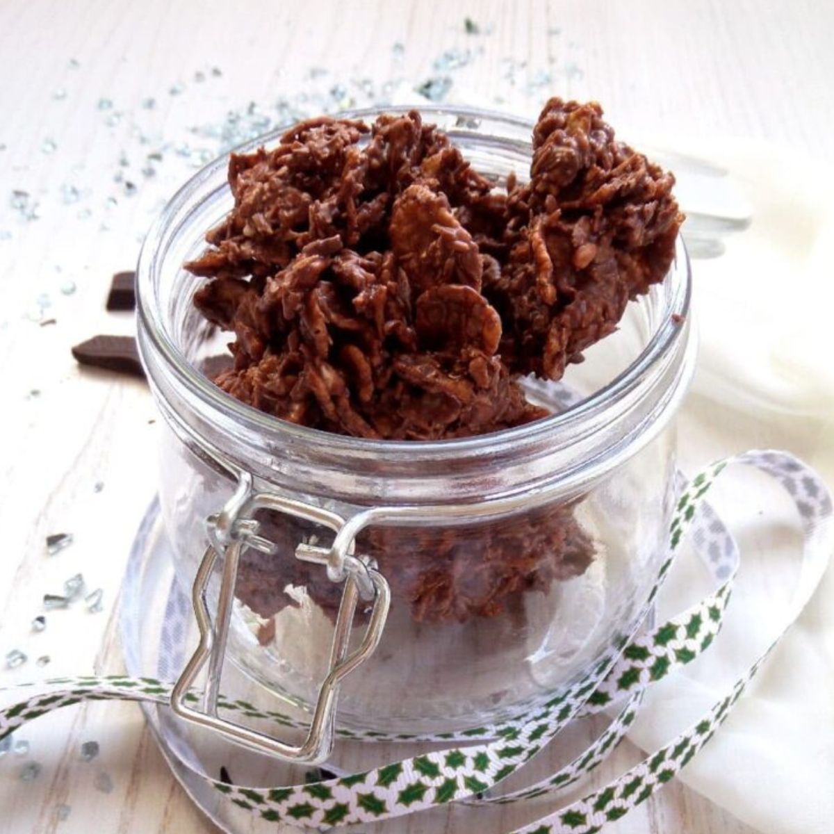 choco crossies in a jar with a ribbon around it.