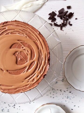 overhead image of a triple chocolate mousse cake with glaze
