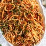 pin image with the title pasta with calamari.
