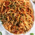 a dish full of pasta with calamari.