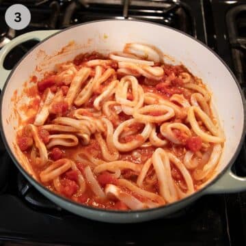 calamari rings cooking in tomato sauce.
