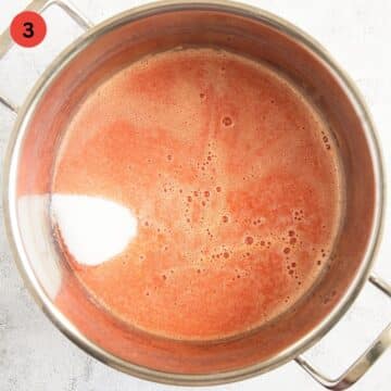 orange puree and granulated sugar in a large pot for making jam.