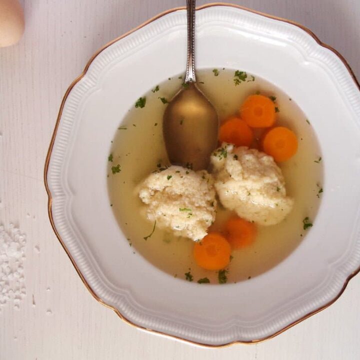 homemade broth with carrots in a plate