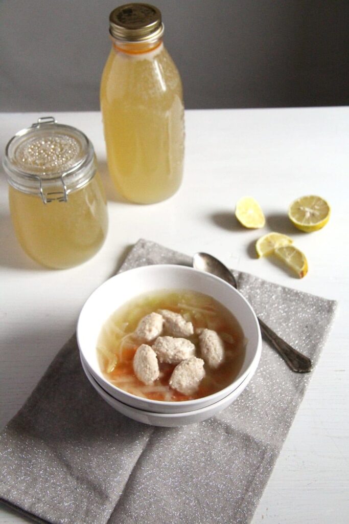 homemade salmon fish stock in bottle and jar