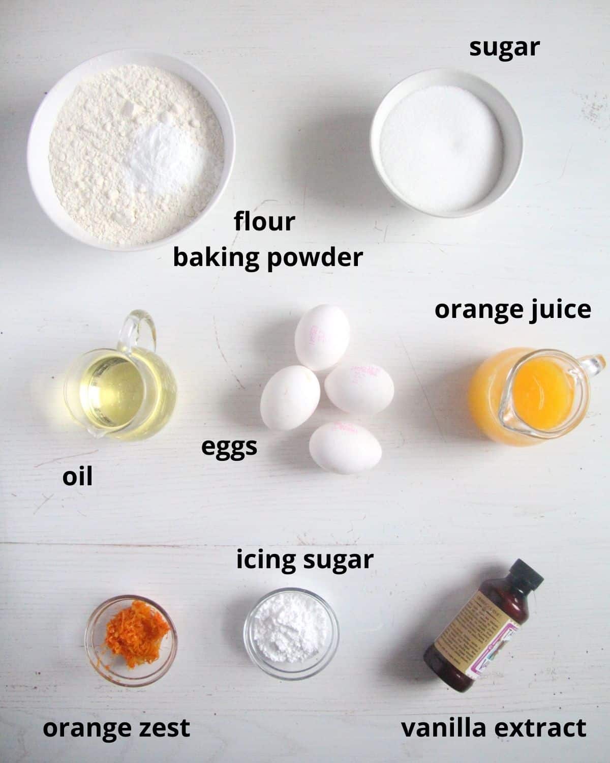 listed ingredients for making orange bundt cake on the table.