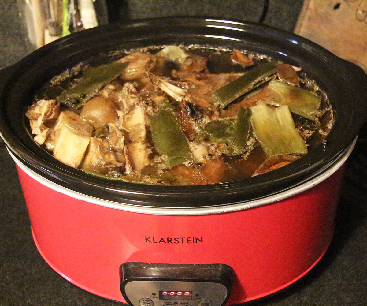 cooked bone broth in a slow cooker.