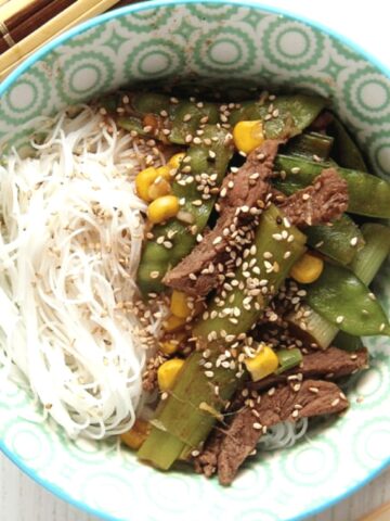 rice noodle bowl with ginger and green onions beef.